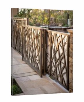 Modern Garden Gate With Intricate Design, Enhancing Outdoor Space and Providing Access to a Beautifully Landscaped Area in Sunny Afternoon Light