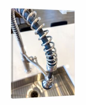 Close-up of industrial kitchen faucet