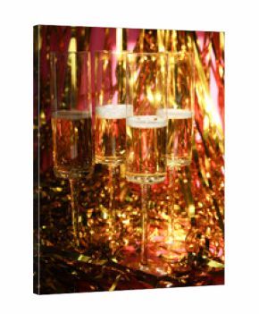 Group of bubbly Champagne Flutes on gold tinsel with pink backdrop