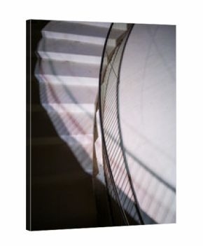 Dramatic Shadows on Curved Staircase Ascent
