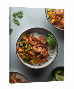Shrimp rice bowl with mango salsa and sliced avocado
