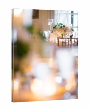 Romantic Indoor Wedding Table with Candles and Floral Centerpiec