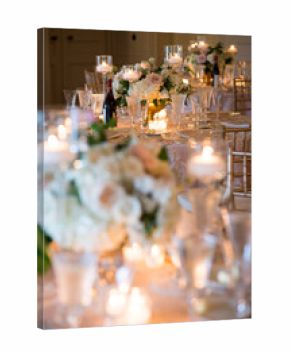 Elegant Candlelit Wedding Reception Table with Floral Centerpiec