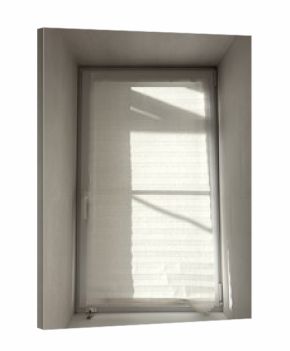 A window with a white curtain is open