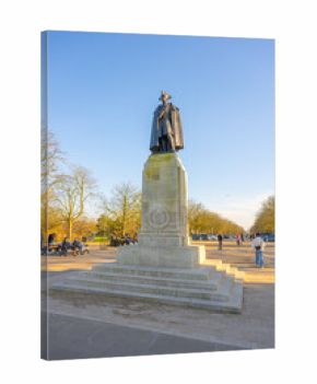 The statue of General James Wolfe stands prominently in Greenwich, London. Surrounded by a peaceful park, it showcases Wolfe's historic significance amidst trees and visitors enjoying the sunny day.