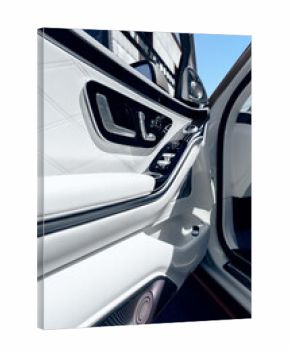 Detail view of luxury car interior showcasing sleek door panel design and modern features