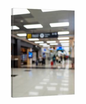 Airport terminal with people and signage. Blurred image. Background.