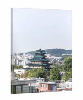 Gyeonbokgung Palace viewed from a hill with Seoul's cityscape behind