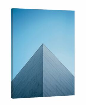 Tall Building Reaches Sky With Glass Facade and Angle View Under Clear Blue Sky