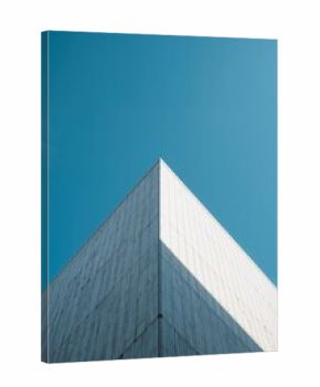 Modern Architecture Stands Against a Clear Blue Sky With Sharp Angles and Simple Lines in a City Setting