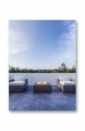 Cozy outdoor seating area with modern fire pit and scenic views at sunset