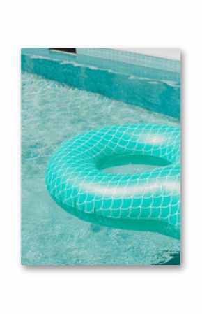 Teal mermaid-scale float ring in clear swimming pool