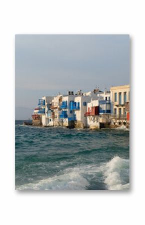 sea and seaside cafe table at Mykonos island, Greece at summer