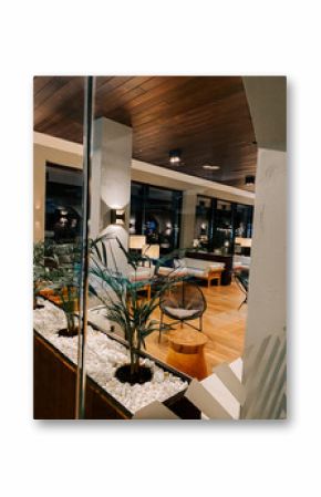 Modern lounge area with stylish decor in a contemporary hotel setting during evening hours