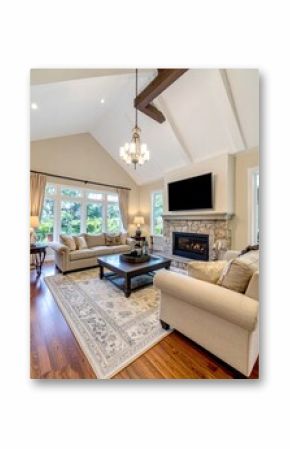 living room in new traditional style luxury home with stone fireplace surround, vaulted ceilings 