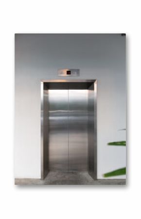 Elevator front door. Glossy stainless steel surface and clean concrete floor in front. Modern design for concepts of architecture, engineering, urban infrastructure and commercial building interiors.