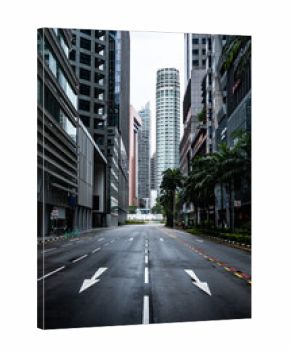 Empty asphalt road between modern buildings in singapore
