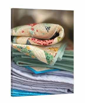 Vertical stack of folded quilts