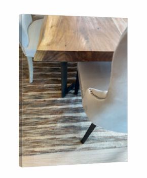Angle view of dining table with mixed fabric seating