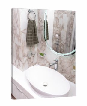 bathroom features sleek oval sink, marble walls, and soft lighting creating serene atmosphere for personal care activities