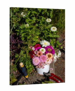 Garden bouquet with clippers, gloves, and hand tool