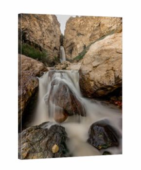 A breathtaking landscape of waterfall in mountains and deep valleys