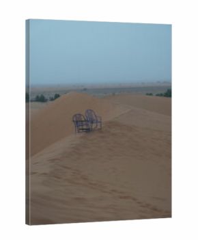Blue chairs on sand dunes Sahara desert