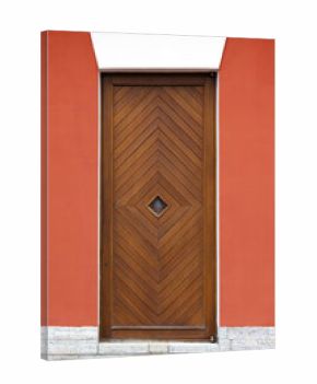 A tall wooden door featuring a chevron pattern sits within a vivid red wall