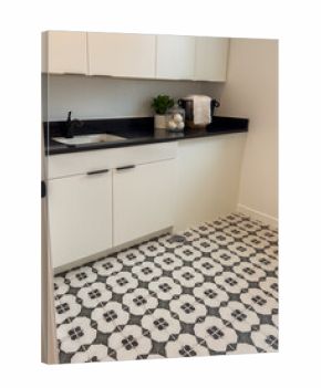 Utility room with patterned tile flooring