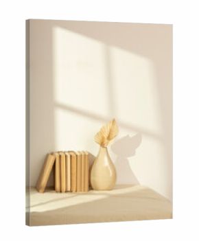 Stack of vintage books and beige ceramic vase with dried leaves on sunlit linen tablecloth