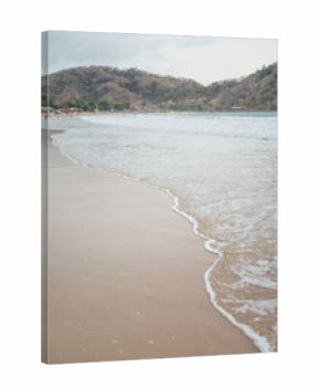 Soft waves washing the sandy shore of Selong Belanak Beach, Lombok