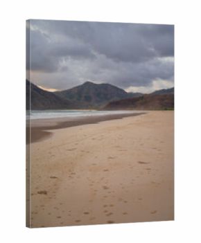 Footprints on the wide sandy shore of Selong Belanak Beach, Lombok
