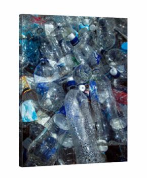 Close up of pile of discarded plastic water bottles vertical