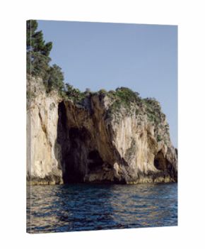 Island with caves on the Amalfi Coast in Italy