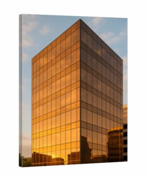 Modern skyscraper reflecting sunset colors in urban setting