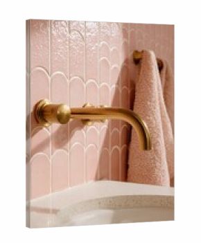 Elegant bathroom design featuring a stylish golden faucet and a soft pink towel against a textured background, showcasing modern aesthetics and comfort in home decor.