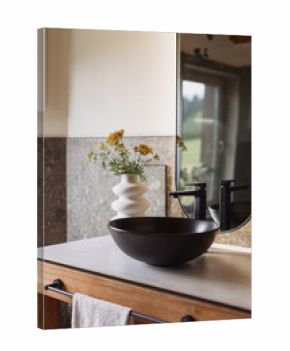 Modern rustic bathroom design featuring a black ceramic washbasin and vase