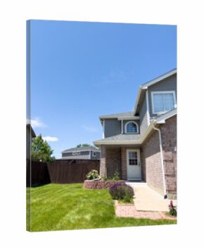 Brick Suburban Home with Green Front Lawn