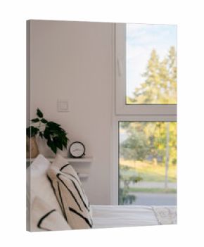 Comfortable modern bedroom in hotel suite with large window and nature view