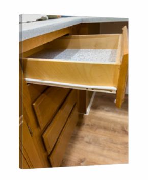 Open wooden kitchen drawer extended outward