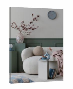 Creative composition of spring living room interior with boucle sofa, stylish coffee table, green stand, glass vase with flowering branches and personal accessories. Home decor. Template.