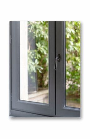 Modern window frame enhancing the living room with a view of the garden