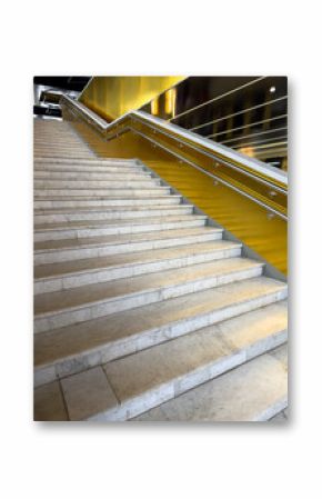 A staircase with a gold railing