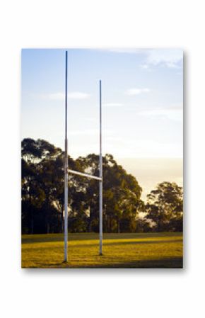 Goal posts for rugby union or rugby league football on a field at sunset in Australia