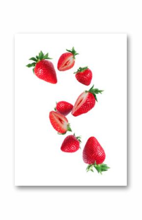 Levitating whole and sliced ​​strawberries in the air on a white background
