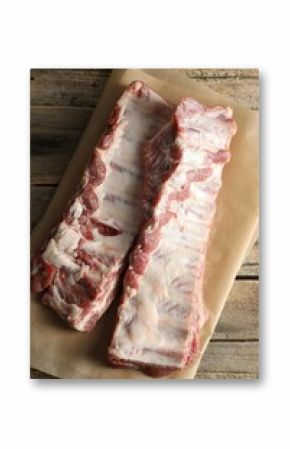 Raw pork ribs on wooden table, top view