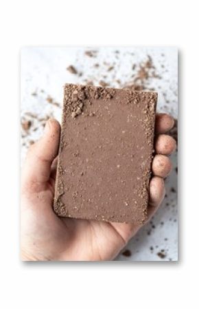 Hand Holding a Brown Recycled Coffee Grounds Eco-Product