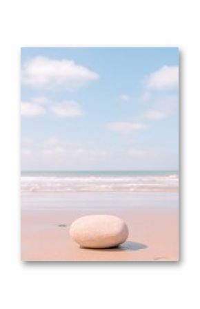 Soft Pastel Beach Scene with Single Rock and Clear Sky