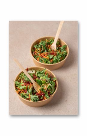 Healthy salad with carrot and beetroot in craft bowl on beige background with copy space. Vegan, diet, food delivery concept