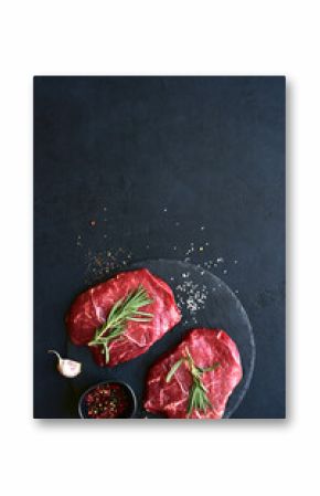 Raw organic marbled beef steak with ingredients for cooking . Top view with copy space.